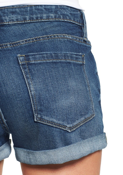 Close up shot of blue roll-over hem button-up distressed denim shorts