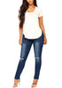 Front full body shot of model in dark blue drawstring-waist washout ripped skinny jeans