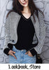 Front of girl in black and white knitted baseball jacket-