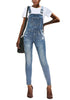 Front view model wearing light blue ripped skinny jeans denim bib overall