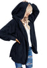 Front view of model in navy snuggle fleece oversized hooded cardigan