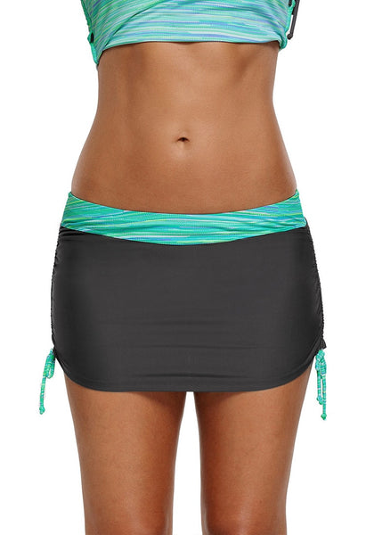 Front view of model showing mint zip-front racerback drawstring tankini set's bottom