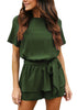 Front view of model wearing army green short sleeves keyhole-back belted romper