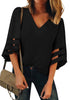 Front view of model wearing  black 3/4 bell mesh panel sleeves V-neckline loose top