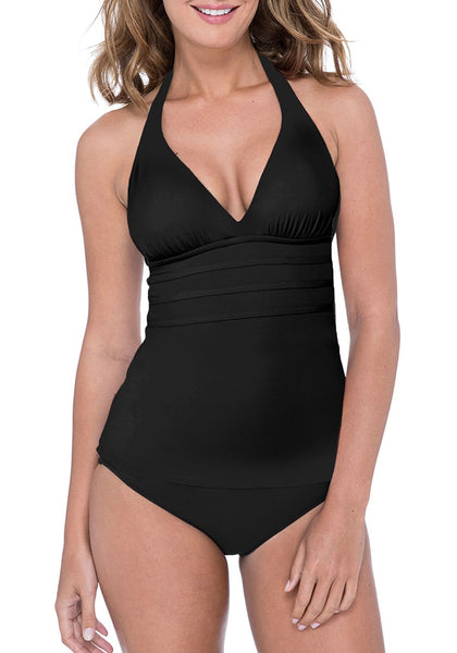 Front view of model wearing black solid color halter tankini set