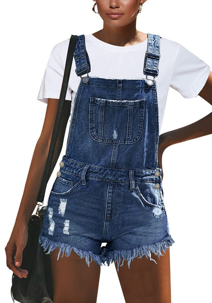 Front view of model wearing blue frayed raw hem denim shorts overall