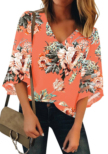Front view of model wearing coral 34 bell mesh panel sleeves V-neckline floral top