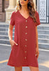 Front view of model wearing dark coral pink V-neck button down short sleeve mini dress