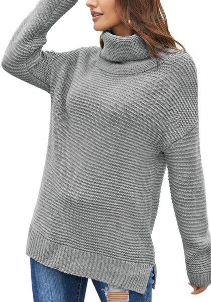 Front view of model wearing grey side slit turtleneck textured knit sweater