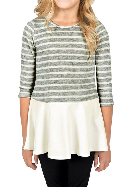 Front view of model wearing grey striped ruffle hem flared girl tunic top