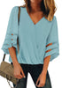 Front  view of model wearing light blue V-neckline mesh bell sleeves loose wrap blouse