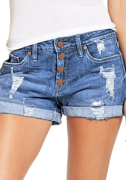 Front view of model wearing light blue roll-over hem button-up distressed denim shorts