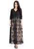 Front view of model wearing plus size black mesh floral sequin maxi  skater dress