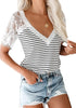 Front view of model wearing white crochet lace short sleeves striped V-neckline top
