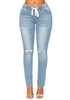 Front view of light blue drawstring-waist washout ripped skinny jeans