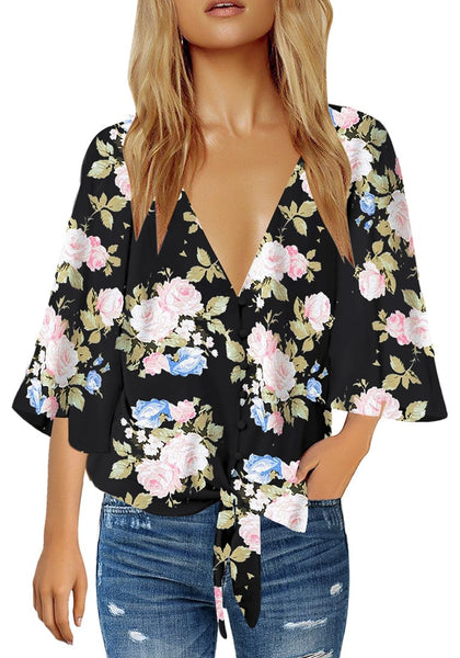 Front view of model wearing black V-neckline button-up tie-front floral top