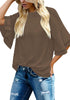 Front view of model wearing brown trumpet sleeves keyhole-back blouse