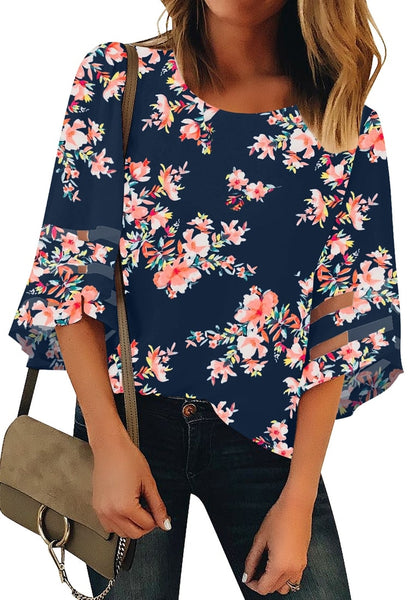 Front view of model wearing dark blue 3-4 bell mesh panel sleeves crew neck floral loose top.