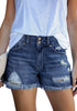 Front view of model wearing dark blue double raw hem ripped jean shorts