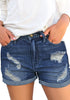 Front view of model wearing dark blue roll-over ripped washed denim shorts