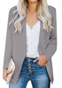Front view of model wearing grey open-front side pockets blazer