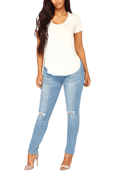 Front view of model wearing light blue drawstring-waist washout ripped skinny jeans