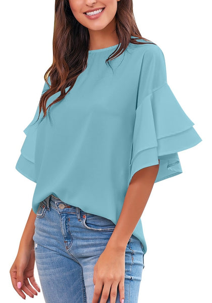 Front view of model wearing light blue trumpet sleeves keyhole-back blouse