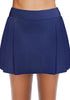 Front view of model wearing navy blue pleated side mid-waist swim skirt