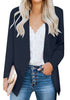 Front view of model wearing navy open-front side pockets blazer