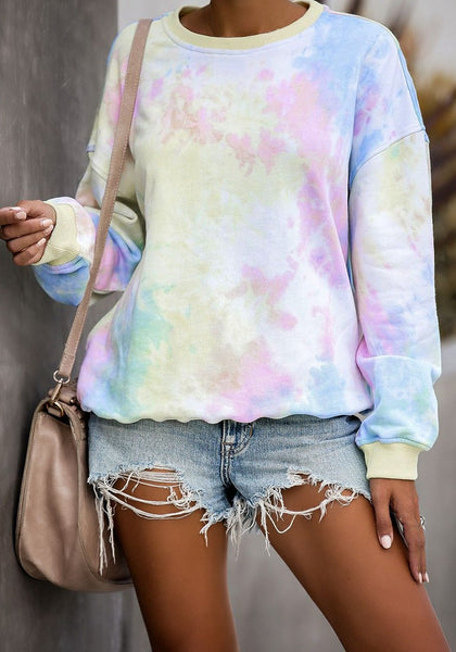 Front view of model wearing pink and blue tie-dye drop shoulder pullover sweater