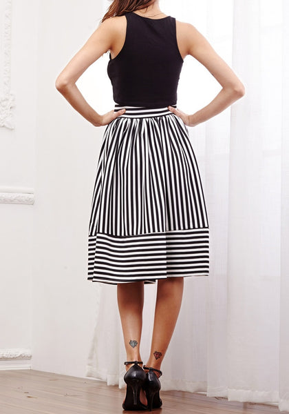 Full back view of model in striped midi skirt