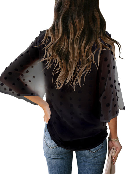 Back view of model black swiss dot 3/4 sleeves tie-front button down top