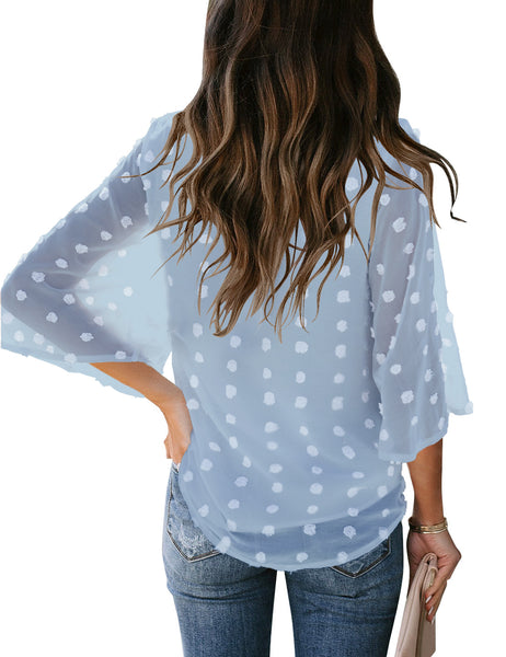 Back view of model wearing light blue swiss dot 3/4 sleeves tie-front button down top