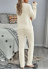 Back view of model wearing beige fuzzy knitted fleece drawstring-waist loungewear set