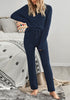 Front view of model wearing navy fuzzy knitted fleece drawstring-waist loungewear set