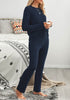 Side view of model wearing navy fuzzy knitted fleece drawstring-waist loungewear set