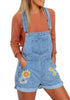 Front view of model wearing light blue floral embroidery rolled hem shorts bib overall