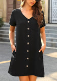 Model poses wearing black V-neck button down short sleeve mini dress