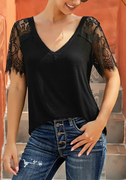 Model poses wearing black crochet lace short sleeves V-neckline top