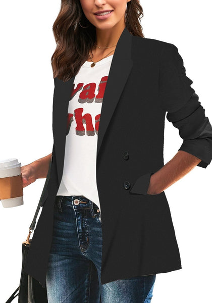 Model poses wearing black double-breasted flap pockets plain lapel blazer