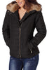 Model poses wearing black faux fur collar zip up quilted jacket