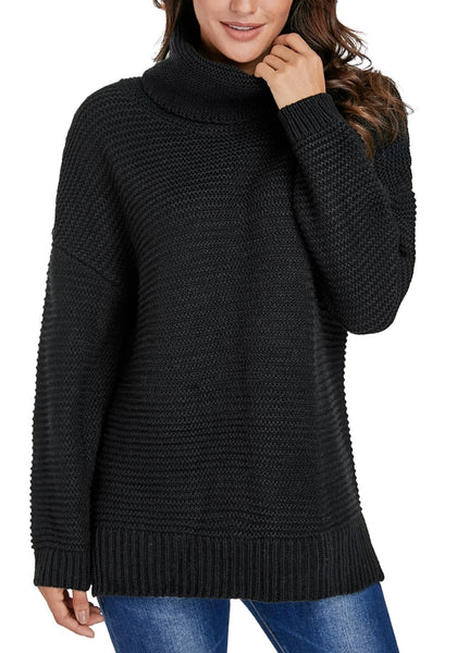 Model poses wearing black side slit turtleneck textured knit sweater