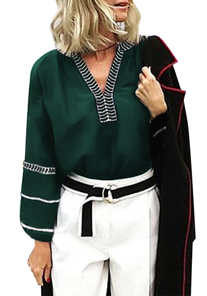 Model poses wearing green notched V-neckline lantern sleeves boho top