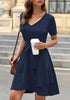 Model poses wearing navy V-neckline short sleeves belted ruffle dress