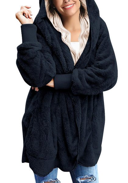 Model poses wearing navy snuggle fleece oversized hooded cardigan