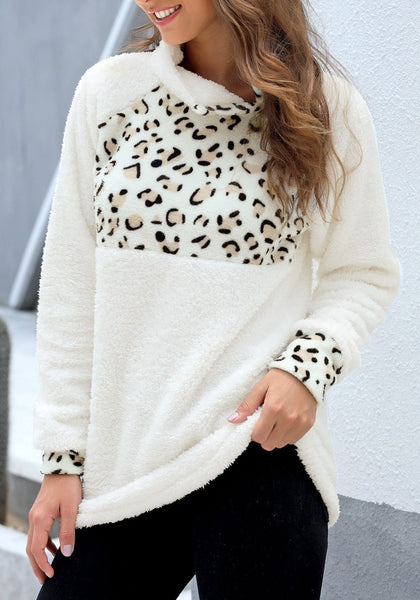 Model poses wearing white oblique stand collar leopard fleece pullover