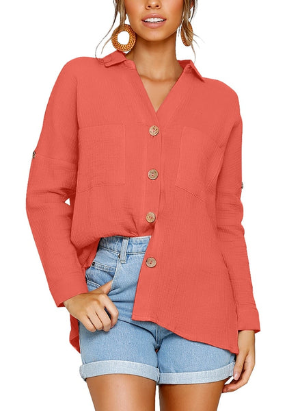 Model wearing coral collared V-neckline cuffed sleeves button-up top