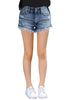 Model wearing medium blue frayed hem distressed denim shorts