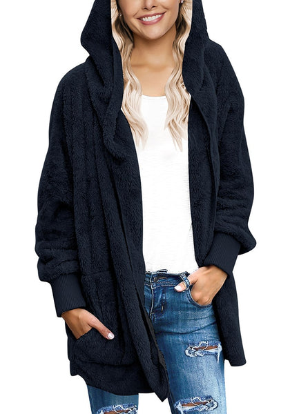 Model wearing navy snuggle fleece oversized hooded cardigan