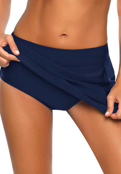 Model wearing navy zipper-pocket waistband skirted bikini bottom showing details